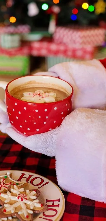 Santa holding a festive mug with hot chocolate and cookies.