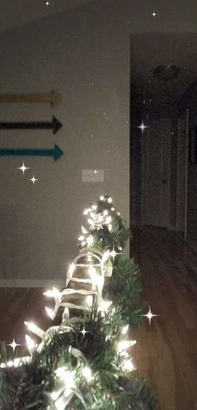 Festive holiday garland with warm string lights along hallway.