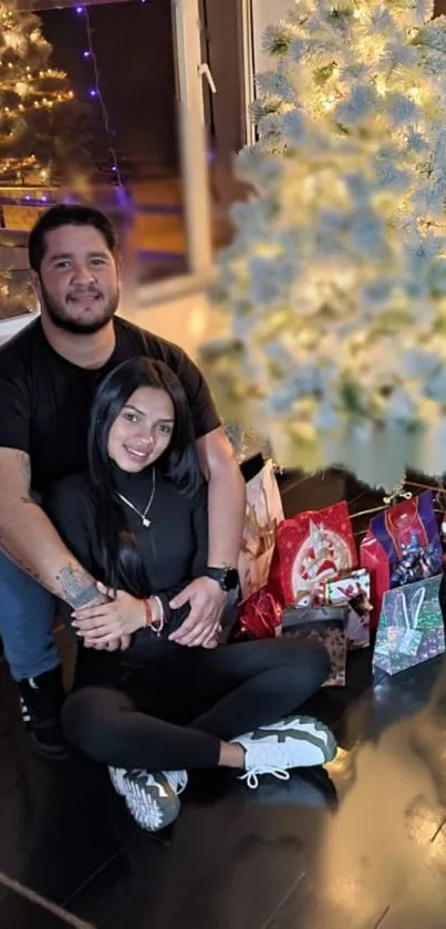 Couple enjoying a festive moment by a decorated Christmas tree.