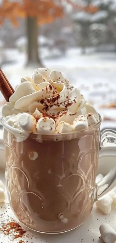 A mug of hot chocolate with marshmallows and cinnamon stick.