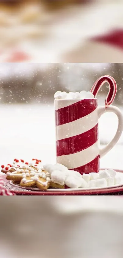 Candy cane mug with hot chocolate and cookies surrounded by snow. Cozy holiday theme.