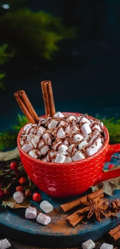 Red cup of hot chocolate with marshmallows and cinnamon sticks.