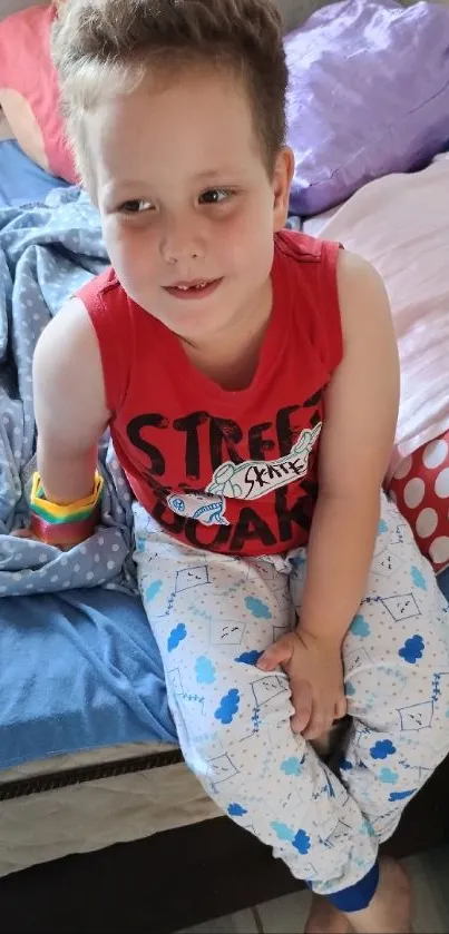 Child sitting on bed in colorful room decor.