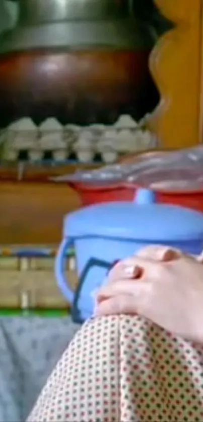 Hands clasped on polka dot fabric in cozy kitchen.