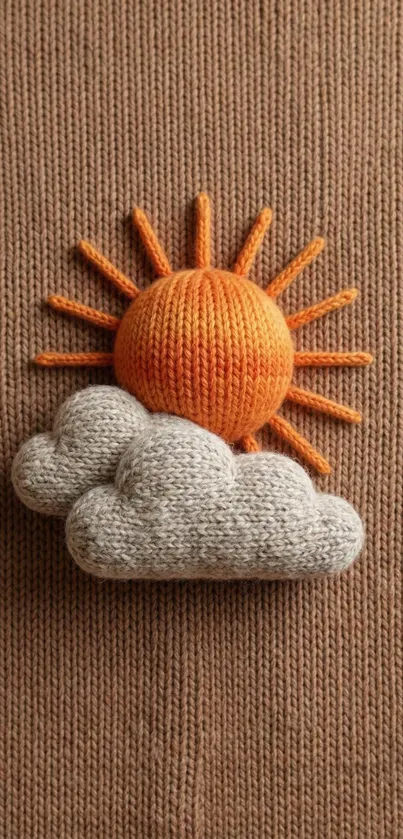 Knitted sun and clouds on brown background.