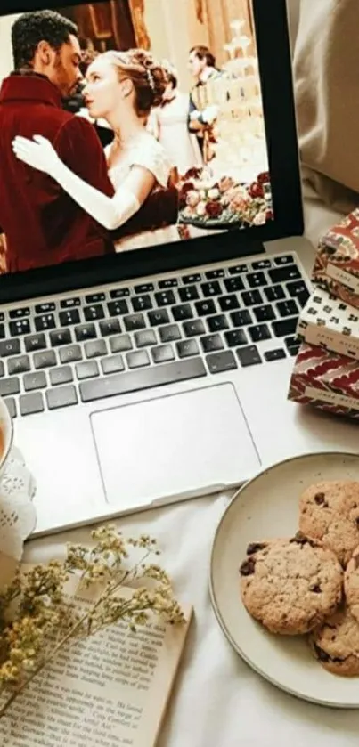 Cozy laptop scene with cookies and tea.