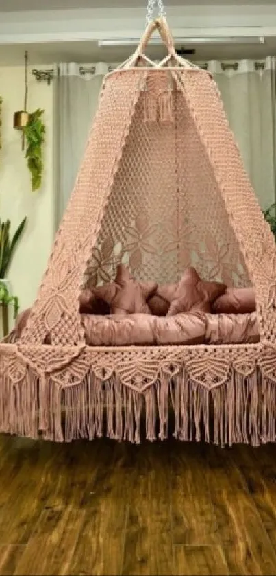 Cozy macrame hanging bed in a bohemian styled room with plants.