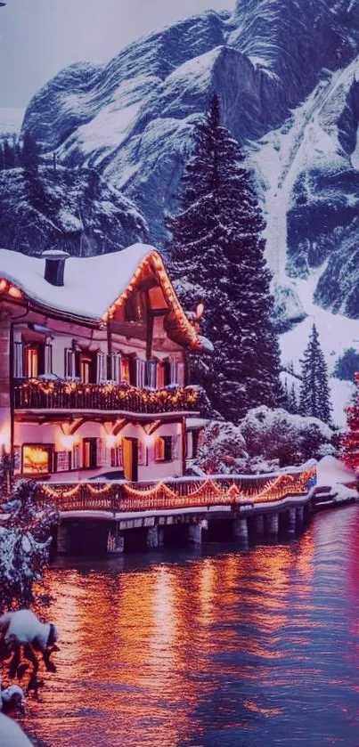 Snow-covered cabin with festive lights by a river.