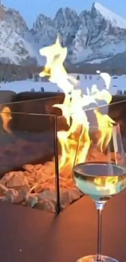 Cozy fireplace with mountain view and a glass of wine.