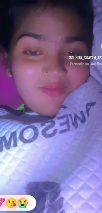 Cozy nighttime portrait wrapped in blanket.