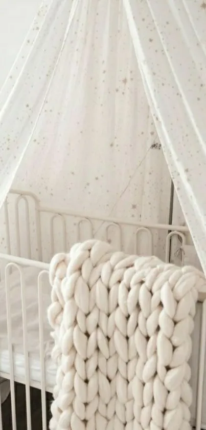 Cream cozy nursery with blanket and crib canopy.