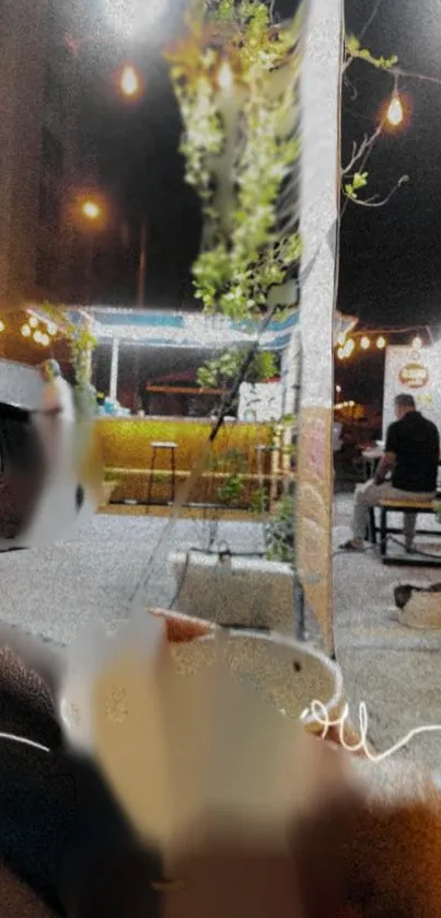 Cozy nighttime outdoor cafe scene with moody lighting.