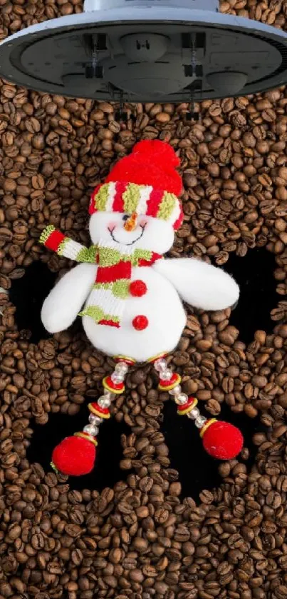 Festive snowman laying on coffee beans, adorned in red and green.