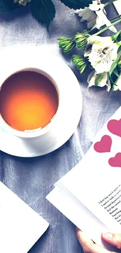 Cup of tea with books and flowers in a peaceful setting.