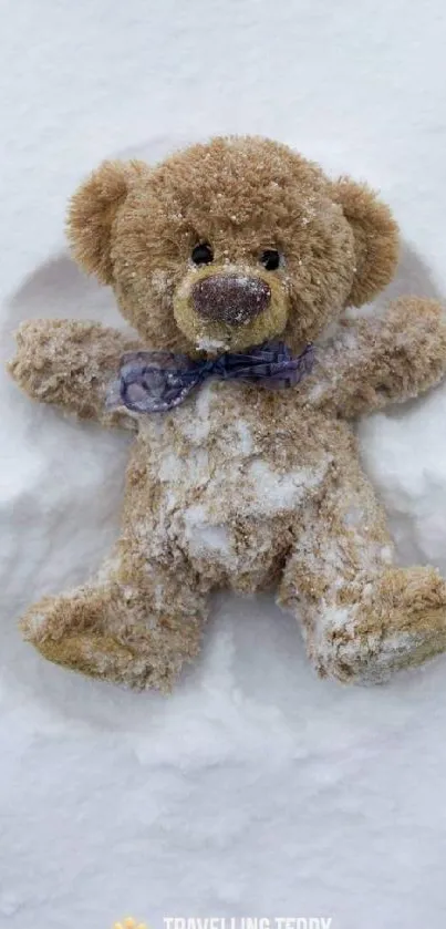 Teddy bear lying in white snow background.