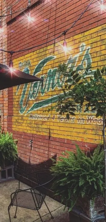 Vintage brick wall with mural and plants in urban patio setting.