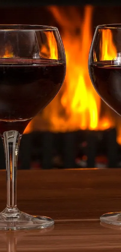 Two wine glasses by a warm fireplace, creating a cozy ambiance.