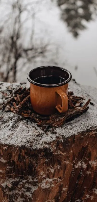 Rustic brown mug on snowy tree stump in winter scene.