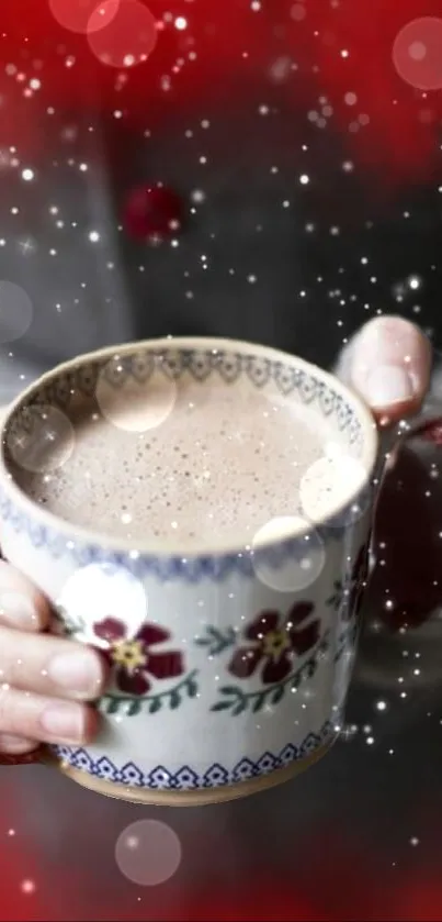 Hands holding a floral coffee mug with snowflakes falling.