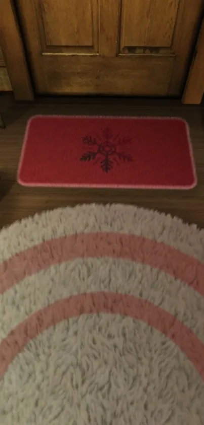 Warm wooden floor with a red snowflake mat.