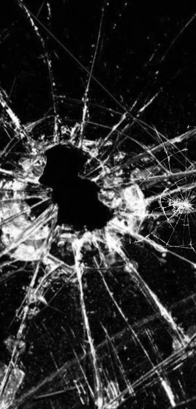 Intricate cracked glass pattern on a black background mobile wallpaper.