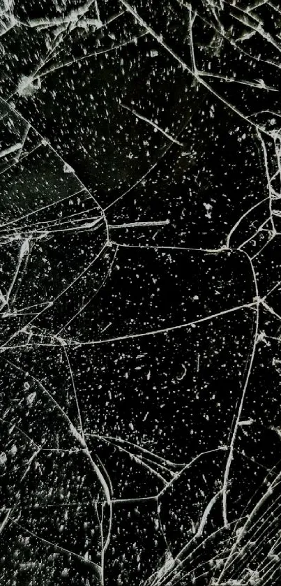 Cracked glass wallpaper with dark background and intricate patterns.