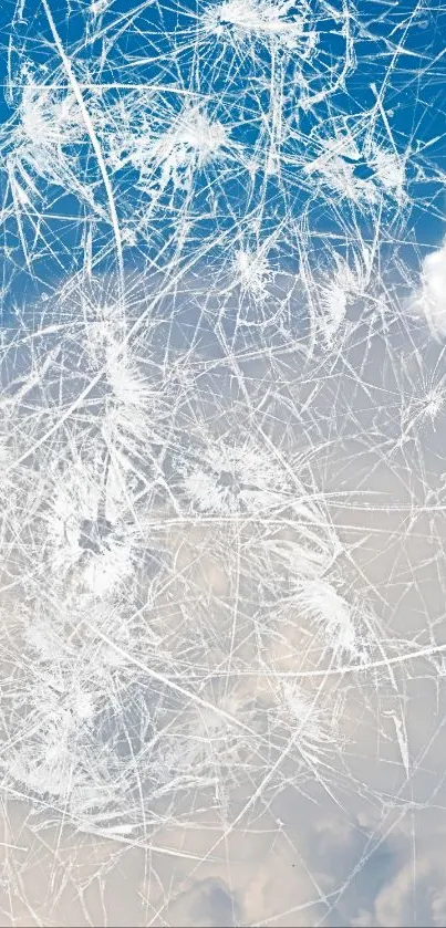 Abstract cracked ice design with sky and clouds.