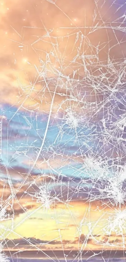 Abstract cracked glass over serene sunset sky wallpaper.