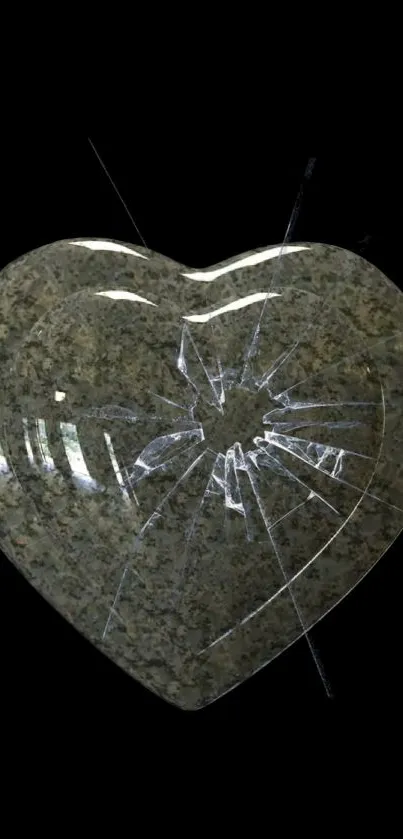 Cracked stone heart on a black background mobile wallpaper.