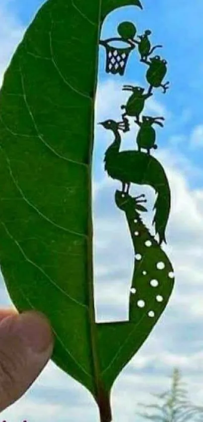 Intricate leaf art carving with animals against blue sky background.