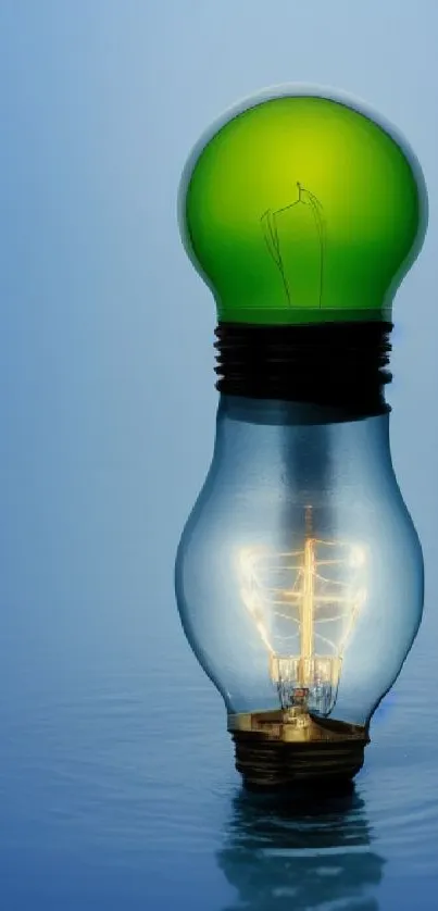 Artistic lightbulb reflecting on water in vibrant green and blue tones.