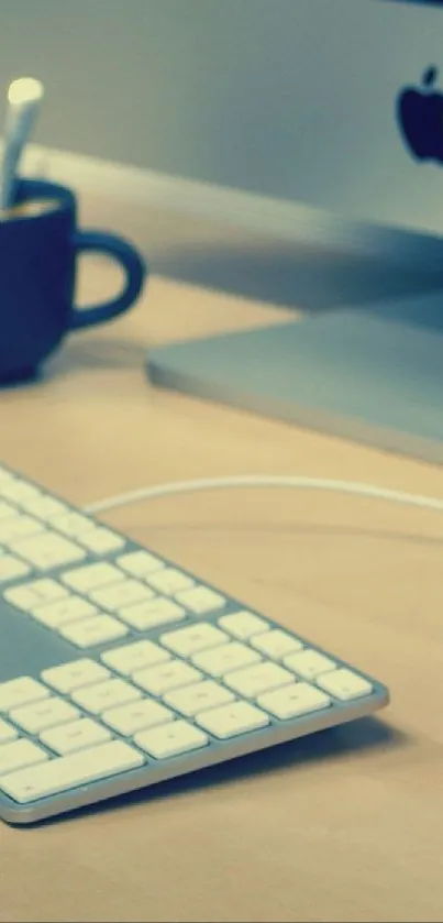 Creative workspace with colorful pencils, keyboard, and monitor.