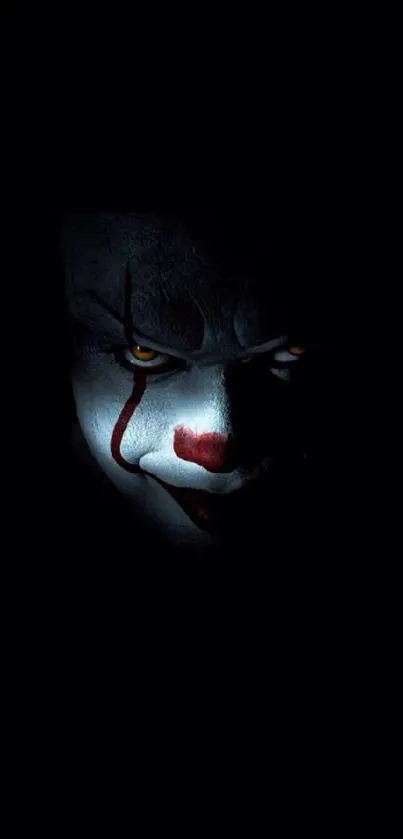 Creepy clown face in darkness mobile wallpaper.