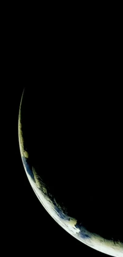 Crescent view of Earth in space with dark background.