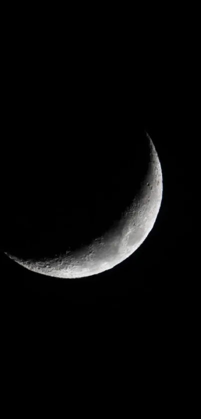 Crescent moon against a dark sky, creating a serene and elegant mobile wallpaper.