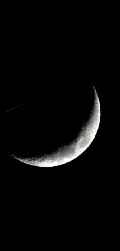 Crescent moon on a serene black background.