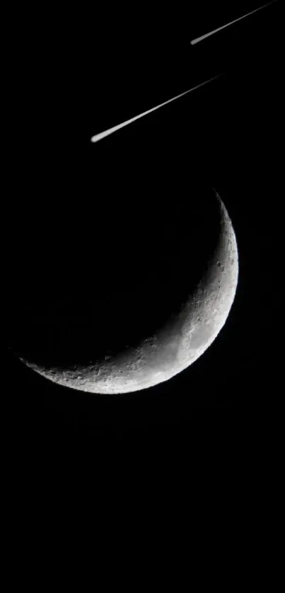 A crescent moon on a black background wallpaper.
