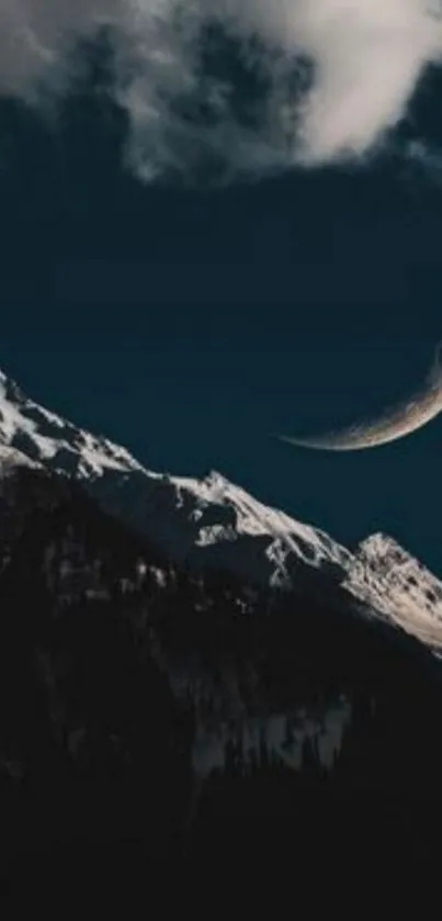 Crescent moon above snowy mountains under dark sky wallpaper.