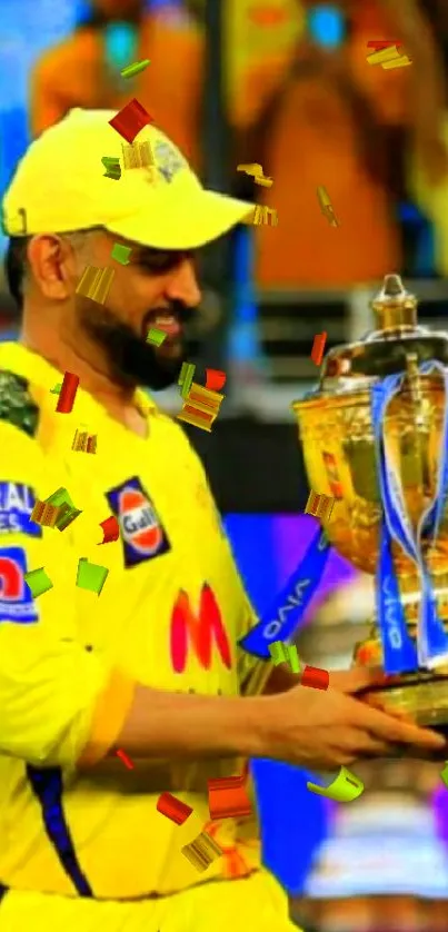 Cricketer in yellow jersey holding a gold trophy.