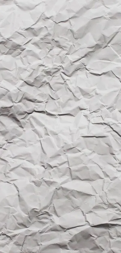 Crumpled white paper texture wallpaper for mobile phones.