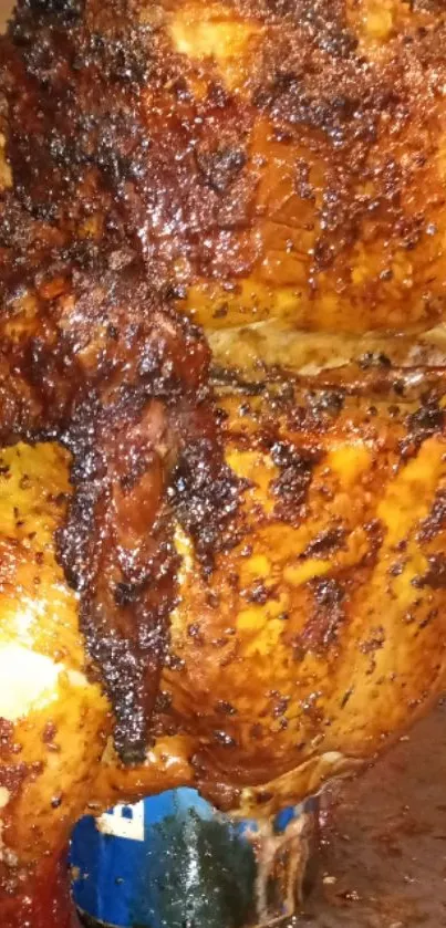 Close-up of a crispy roast chicken with golden-brown skin.