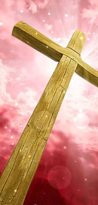 Wooden cross in glowing pink sky with celestial ambiance.