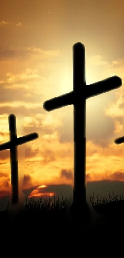 Silhouetted crosses against a vibrant sunset sky, perfect for mobile.