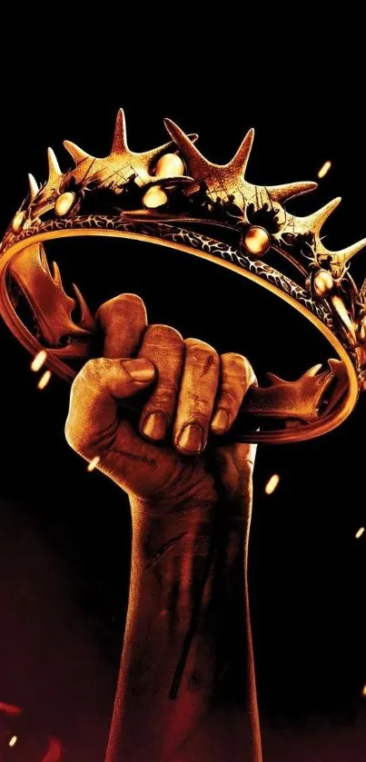 Hand holding a spiked crown with dramatic lighting.