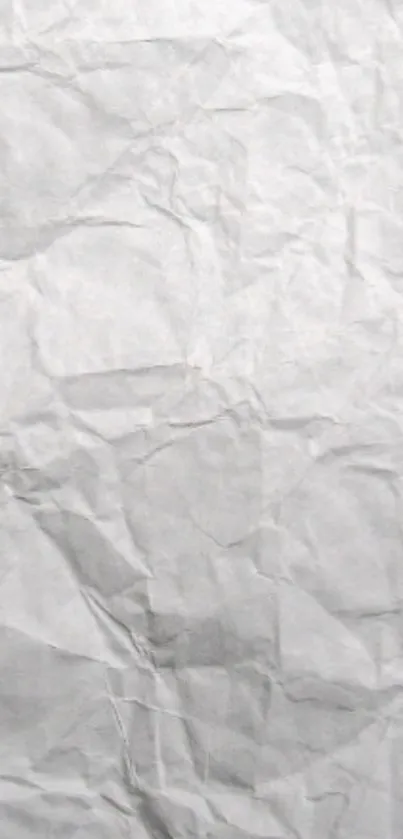 Gray crumpled paper texture wallpaper.