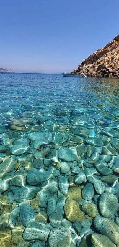 Crystal clear ocean with turquoise water and rocky shore view.