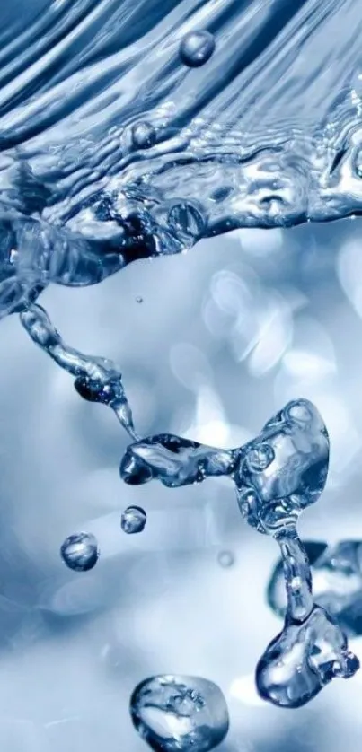 Dynamic close-up of water droplets in motion against a blue background.