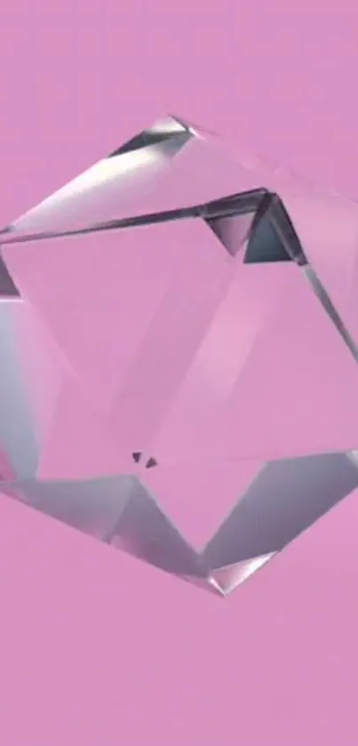 Clear geometric crystal on pastel pink background.