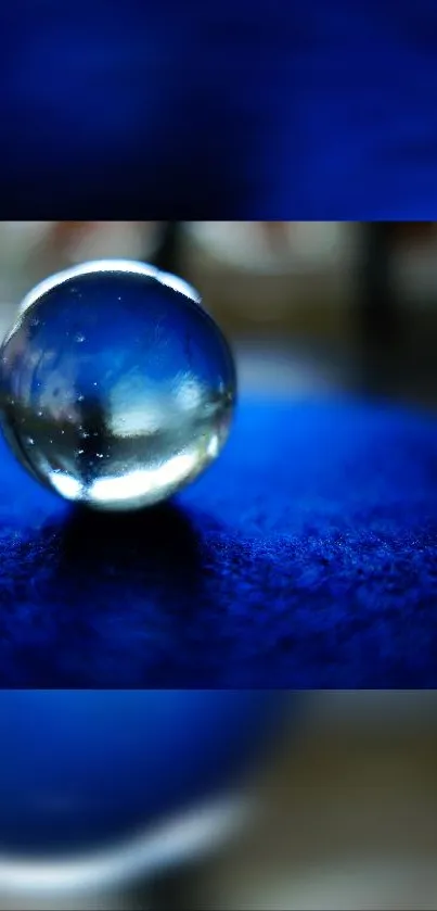 A crystal orb on a vibrant blue textured surface.