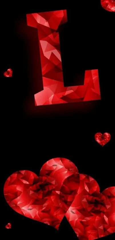 Red crystal 'L' with hearts on black background wallpaper.